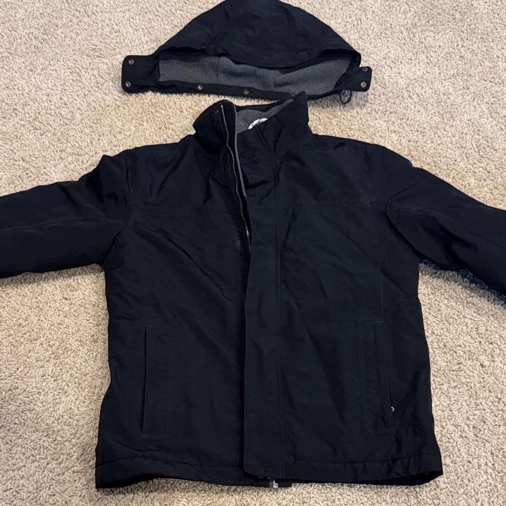 Black Squall Jacket. Removable hood. waterproof, windproof and fleece lining